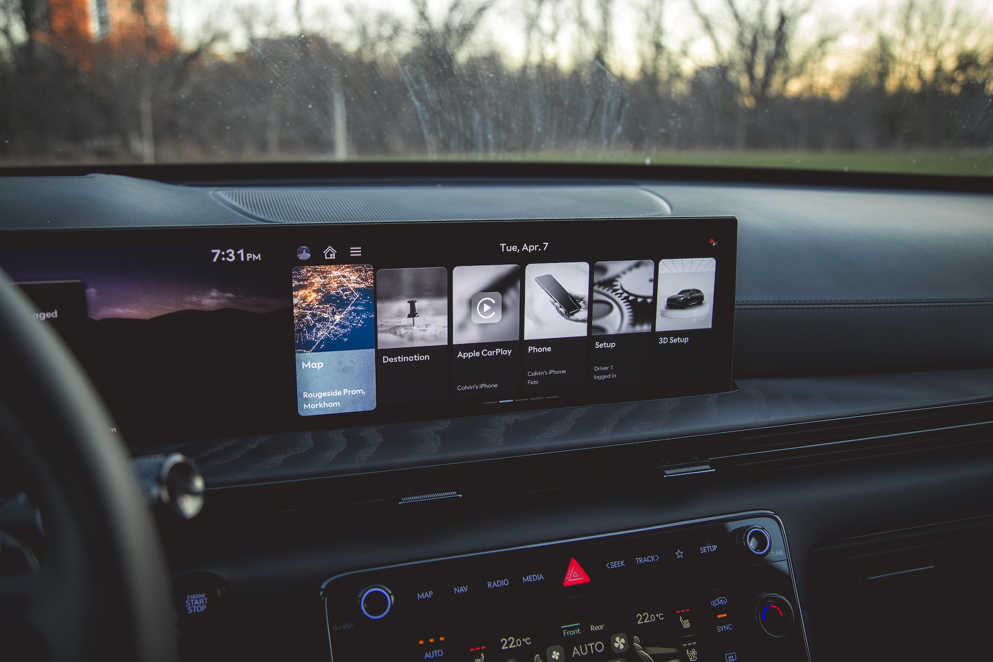 Interior view of a car dashboard featuring a digital display with options for Map, Destination, Apple CarPlay, Phone, Setup, and 3D Setup, showing the current time as 7:31 PM.